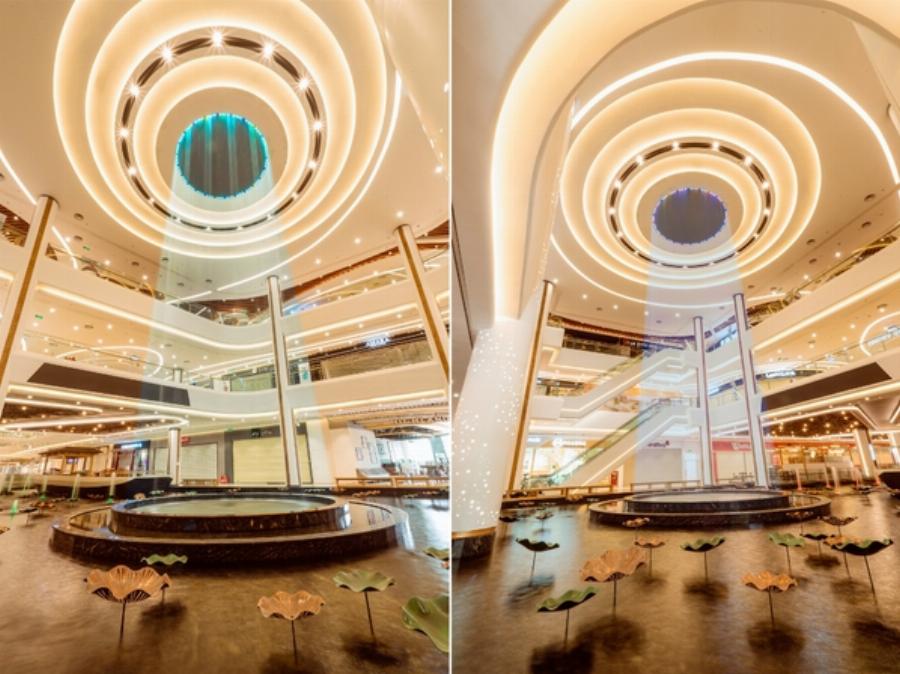 Không gian bên trong nhà hàng Lyn Vincom Royal City với bàn ghế gỗ, ánh sáng vàng ấm cúng và cây xanh trang trí.