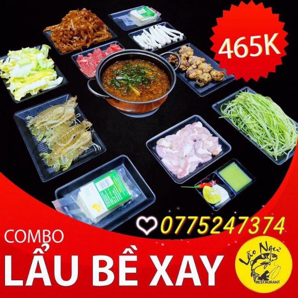 Nồi lẩu uyên ương Manwah với hai vị nước lẩu đặc trưng, khói bốc nghi ngút, xung quanh là các đĩa đồ nhúng hấp dẫn